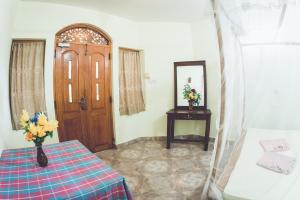 Postel nebo postele na pokoji v ubytování Rupa's Hotel