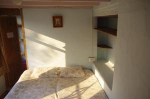 Postel nebo postele na pokoji v ubytování Orchard Huts