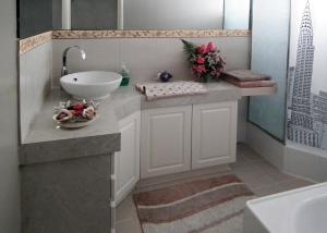 a bathroom with a sink and a counter with a sink at The Spanish Guesthouse, Private Rooms in Perth +21 photos