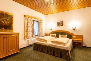 Posteľ alebo postele v izbe v ubytovaní Hotel Pass Lueg