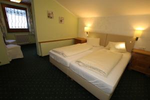 Posteľ alebo postele v izbe v ubytovaní Hotel Pass Lueg