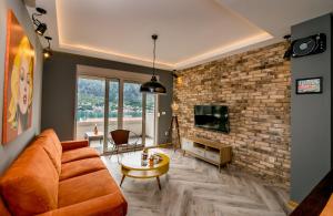TV a/nebo společenská místnost v ubytování Apartments Magic Sea View