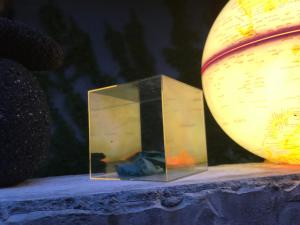 a box on a stage next to a globe at Sayama Aesthetics School in Osakasayama