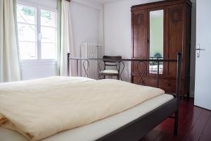 Ein Bett oder Betten in einem Zimmer der Unterkunft Hotel Flosdorff - Appartements