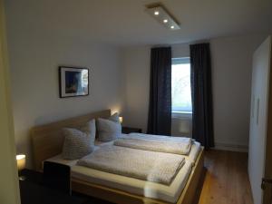 Säng eller sängar i ett rum på BS Living Apartment 4
