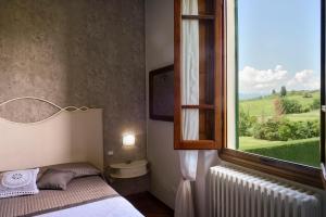 Posteľ alebo postele v izbe v ubytovaní Villa Le Facezie B&B