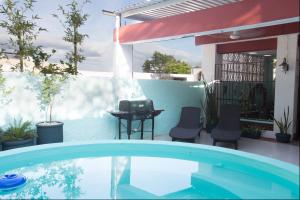 Bazén v ubytování Merida Serviced Apartments nebo v jeho okolí