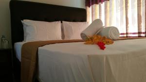 Postel nebo postele na pokoji v ubytování Rivonway Hotel Polonnaruwa