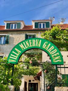 een bord voor een wijnmakerij voor een gebouw bij Luxury Villa Minerva Gardens in Split