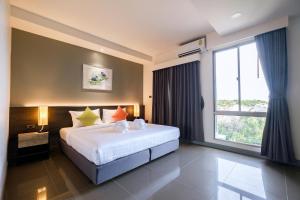 Katil atau katil-katil dalam bilik di Clover Hotel Hatyai