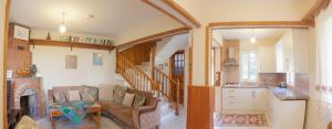 a kitchen and living room with a couch and a table at Villa Gardenia in Dalyan