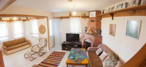 a living room with a couch and a fireplace at Villa Gardenia in Dalyan