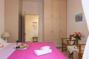 Кровать или кровати в номере Erofili's House cozy sea and valley panoramic view apartment