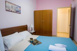 Кровать или кровати в номере Erofili's House cozy sea and valley panoramic view apartment