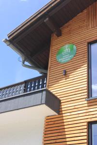 a building with a sign on the side of it at KWT Lodge in Mittelberg