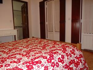 a bedroom with a bed and a dresser at Casazul Milfontes in Vila Nova de Milfontes
