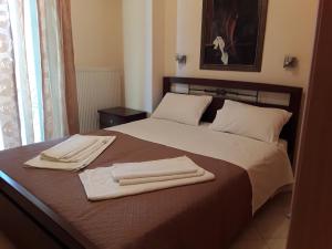 Кровать или кровати в номере Dais Apartments