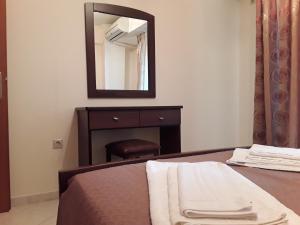 Кровать или кровати в номере Dais Apartments