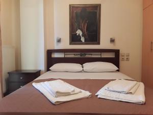 Кровать или кровати в номере Dais Apartments