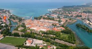 an aerial view of a town next to a river at Le Mura apartment in Peschiera del Garda