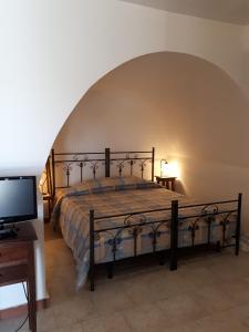 Postel nebo postele na pokoji v ubytování Masseria Cassiere