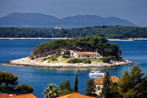 a house on a small island in the water at All About the Sea - Riviera House near the center of Hvar in Hvar