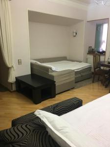 Postel nebo postele na pokoji v ubytování Guesthouse Zeinabi