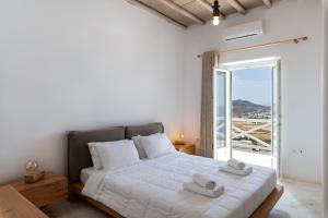 Postel nebo postele na pokoji v ubytování Mykonos Divino + 37 fotografií