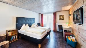 Posteľ alebo postele v izbe v ubytovaní Hotel Aloisia, Hotel Garni