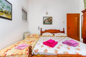 Postel nebo postele na pokoji v ubytování Apartment Mario
