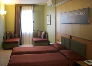 Voodi või voodid majutusasutuse Hotel Orazio toas