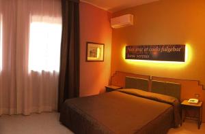 Voodi või voodid majutusasutuse Hotel Orazio toas