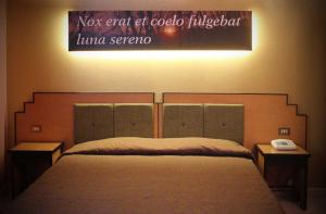Voodi või voodid majutusasutuse Hotel Orazio toas