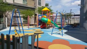 a playground with a slide and a slideintend at Residence @ Shaftsbury Cyberjaya in Cyberjaya