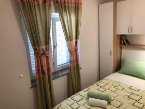 Ein Bett oder Betten in einem Zimmer der Unterkunft Apartments Galic