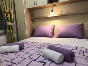 Ein Bett oder Betten in einem Zimmer der Unterkunft Apartments Galic