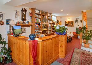 a room with a desk with a computer on it at Pension Villa Claudia Augusta in Resia +38 photos