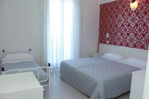 Postel nebo postele na pokoji v ubytování Hotel Stella Polare
