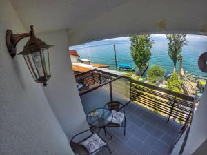 a balcony with a view of the ocean at Kostoski Villa in Ohrid