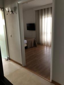 TV a/nebo společenská místnost v ubytování Hotel Paiva