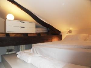 Un pat sau paturi într-o cameră la Loft Botero