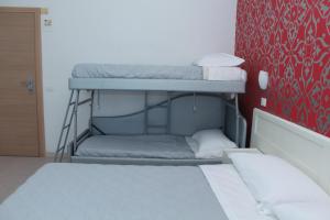 Postel nebo postele na pokoji v ubytování Hotel Stella Polare