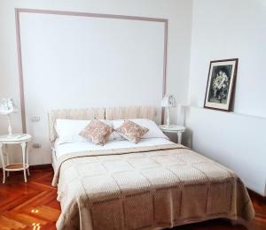 Postel nebo postele na pokoji v ubytování Miglioranzi Rooms
