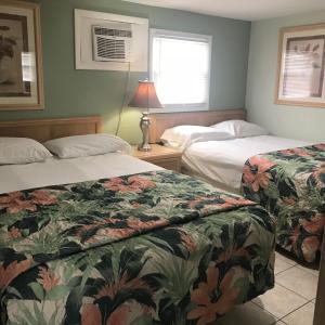 Postel nebo postele na pokoji v ubytování Mallard Apartments