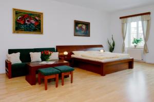 Postel nebo postele na pokoji v ubytování Městský Hotel Dorinka