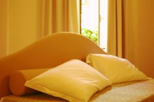 Łóżko lub łóżka w pokoju w obiekcie Residence Villa Firenze