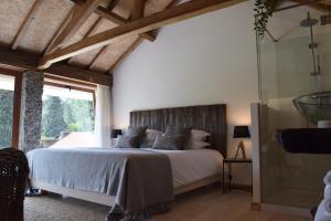 Cama ou camas em um quarto em Villa Margaridi