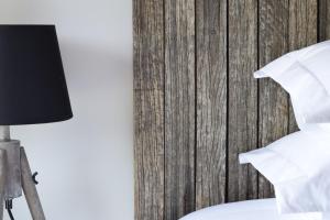Cama ou camas em um quarto em Villa Margaridi