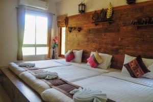 Postel nebo postele na pokoji v ubytování Pai Iyara Resort