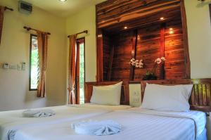 Postel nebo postele na pokoji v ubytování Pai Iyara Resort